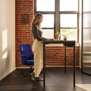 Humanscale eFloat Quattro Sit-Stand Desk in a modern office